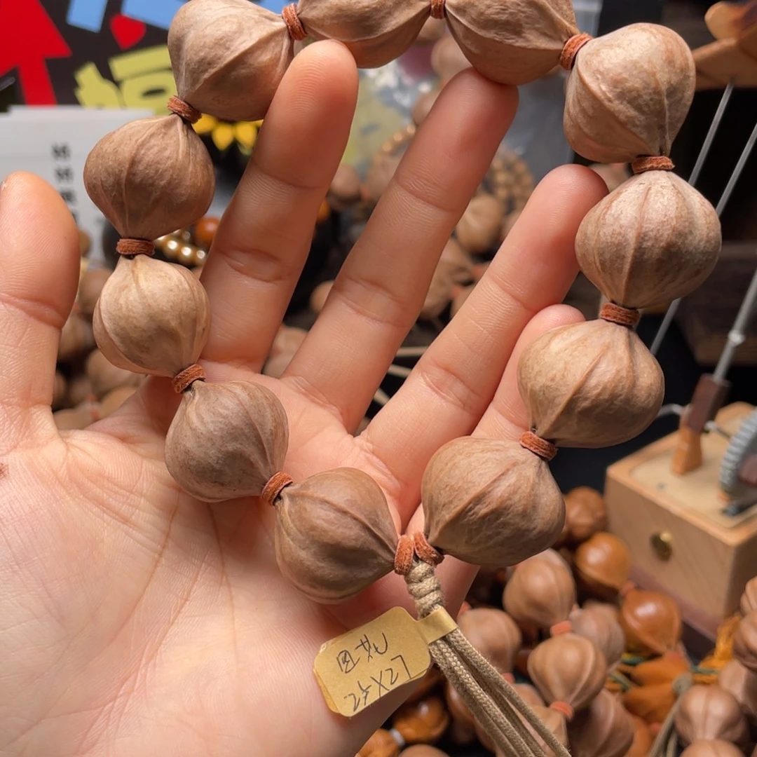 馋***位吊坠橄榄核2527四花铁核