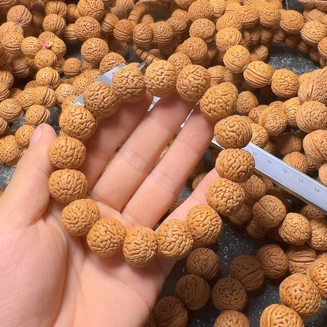桃核吊坠虎皮肌肉手串
