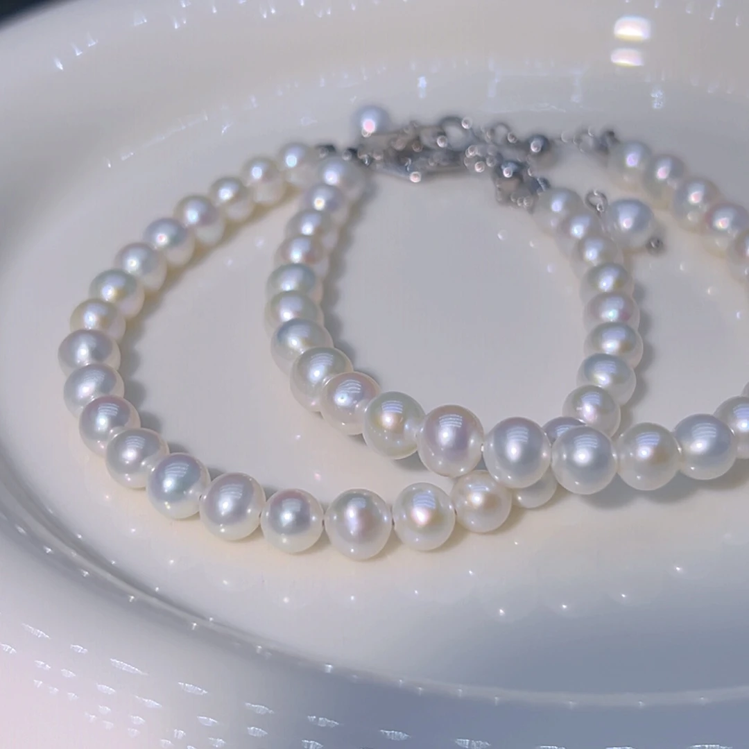 钛钢淡水珍珠5.5到6近圆丝绸极光天然珍珠