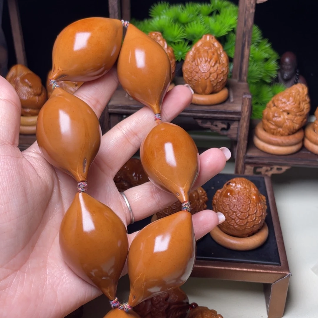 吊坠橄榄核手持长光珠