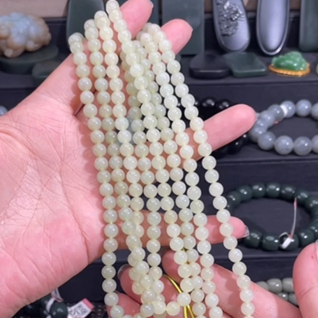 和田玉新疆若羌黄口卡6圆珠108单条颜色淡黄