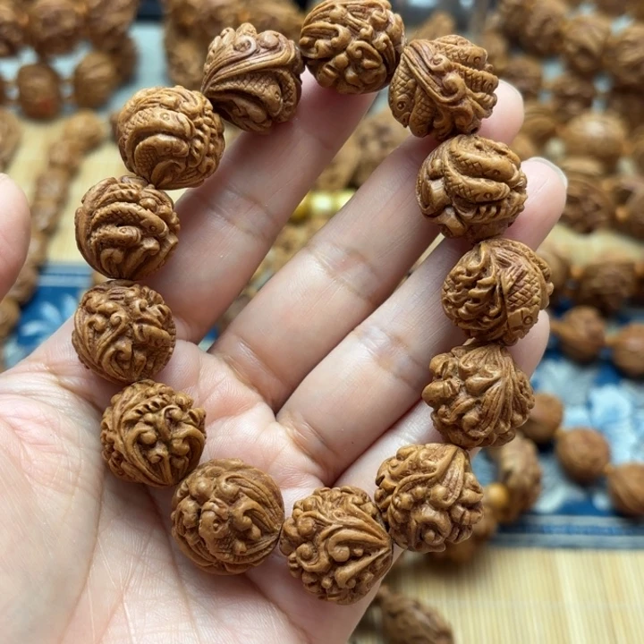 等***时桃核雕刻九龙手串