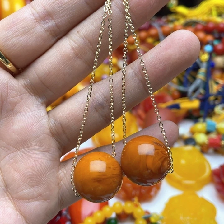 树脂制品73号橘色耳线