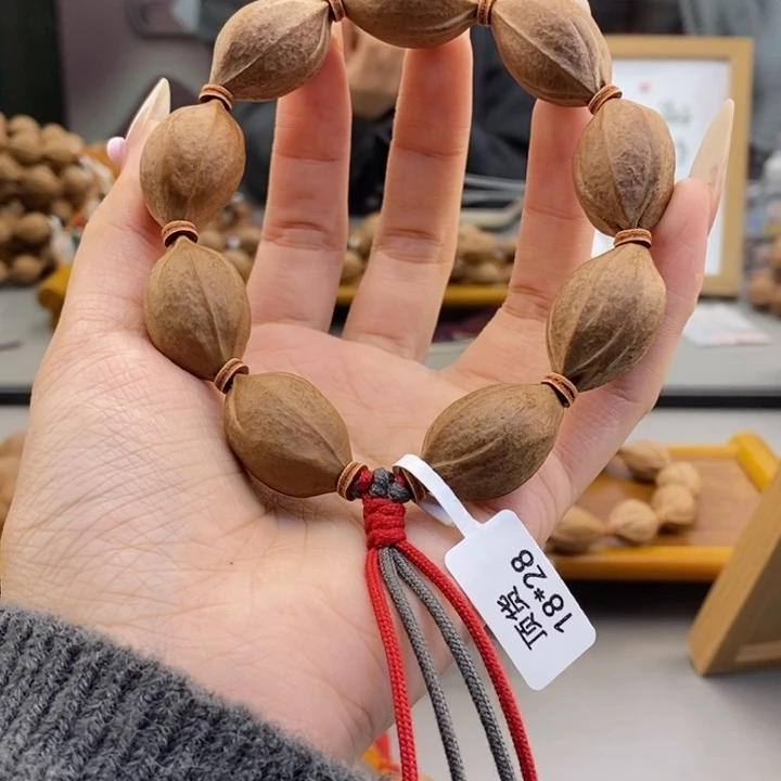 吊坠橄榄核隔**董梅林铁