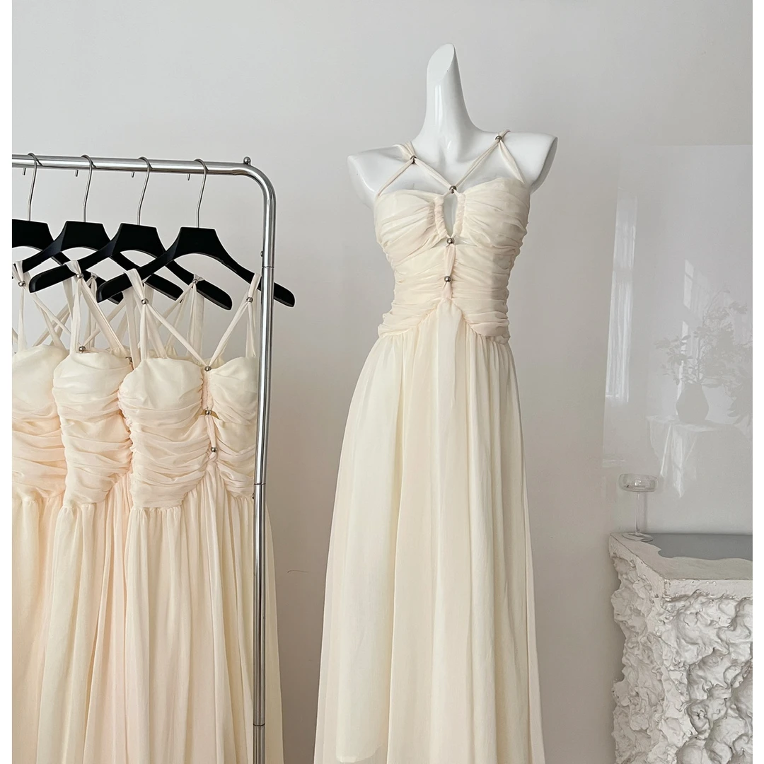 气质轻奢法式挂脖吊带大裙摆连衣裙夏季收腰褶皱雪纺白色显瘦长裙