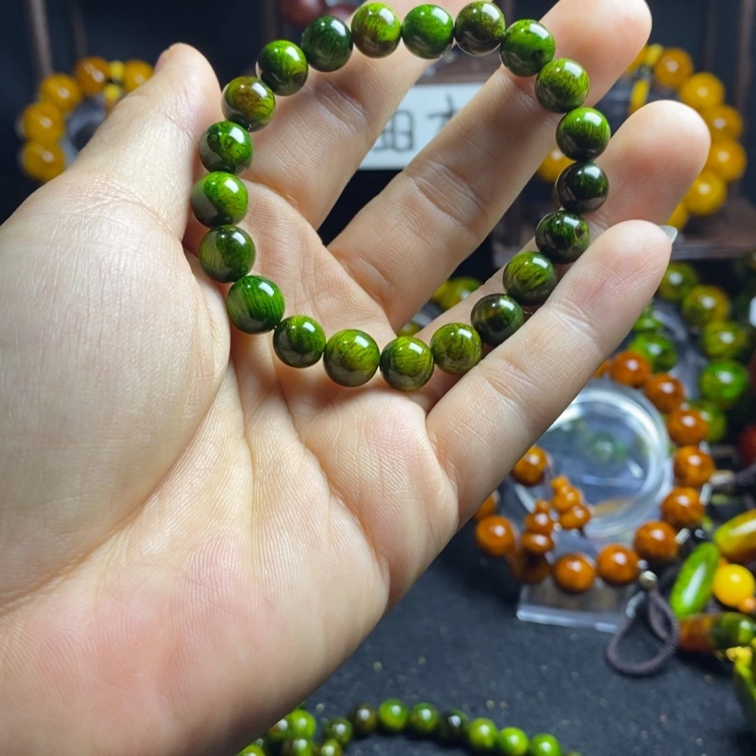 玉***福木质非金属琥珀木0.8尺寸水墨丹青手串