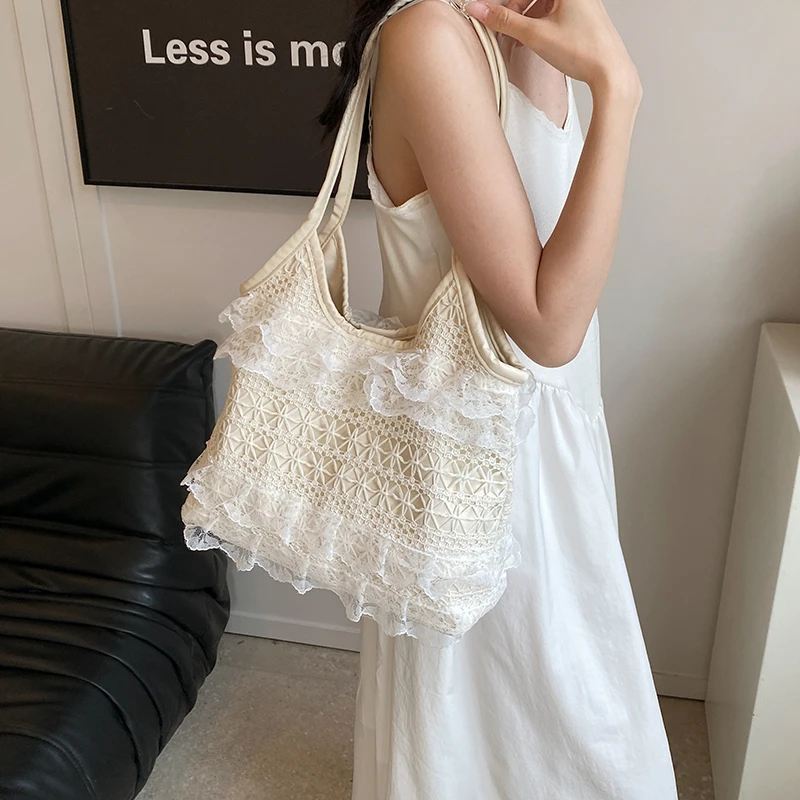 通勤大容量包包女士2025新款夏天蕾丝镂空编织单肩包大学生托特包