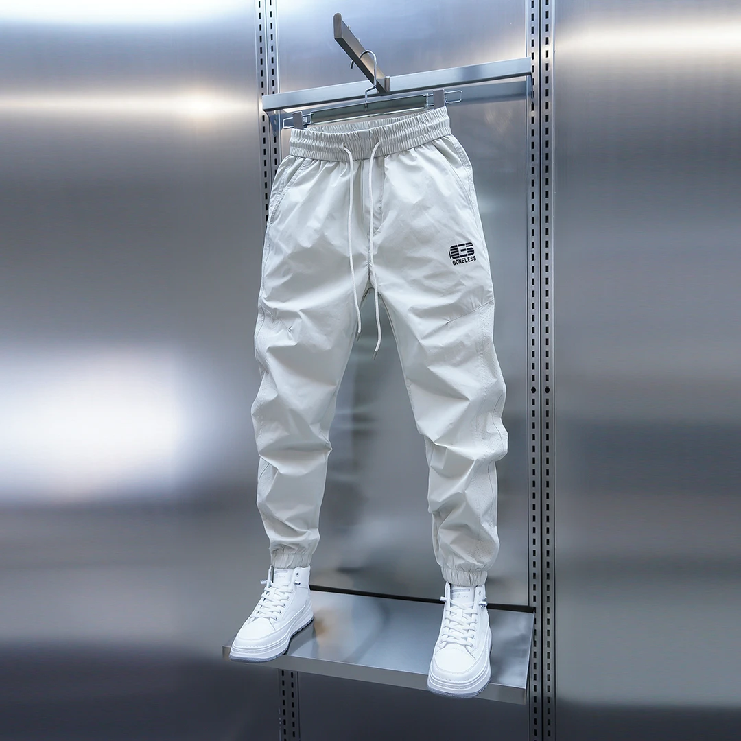 2025夏季薄款男士速干休闲裤打孔透气空调裤百搭束脚纯色小脚裤