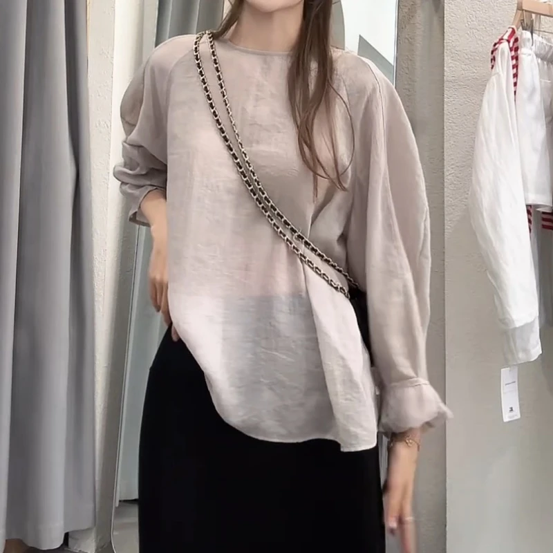 2025夏季新款百搭气质设计感气质弯刀袖微透衬衫LK2503866
