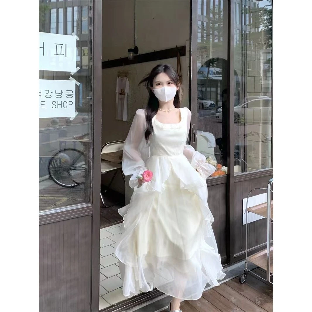 一罐杏仁桃法式白色连衣裙秋冬长袖设计感小众仙气网纱长裙仙女裙