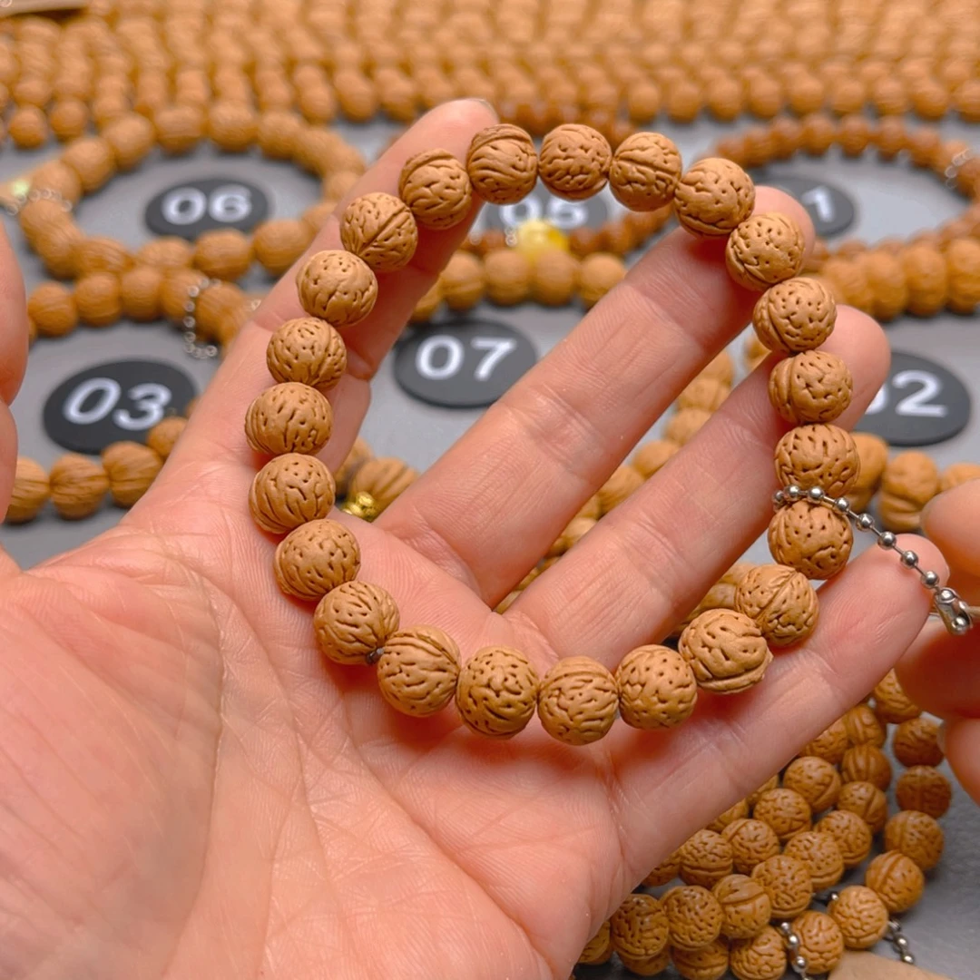 习***李菩提籽类桃核手串