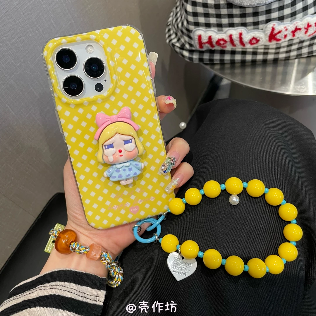 卡通黄菱格立体哭娃手提链条适用苹果16promax15/14iPhone手机壳