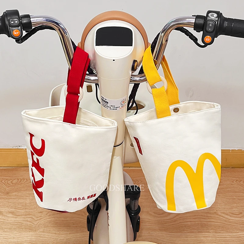 麦当当电动车挂包可爱卡通电瓶车前置收纳手机包多功能便携水桶包