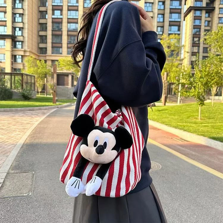 新疆包邮洋洋女包潮流卡通米奇条纹水桶包