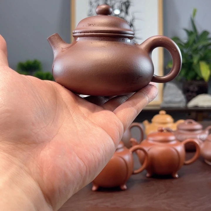 ****"紫砂公道杯底槽清半手容天