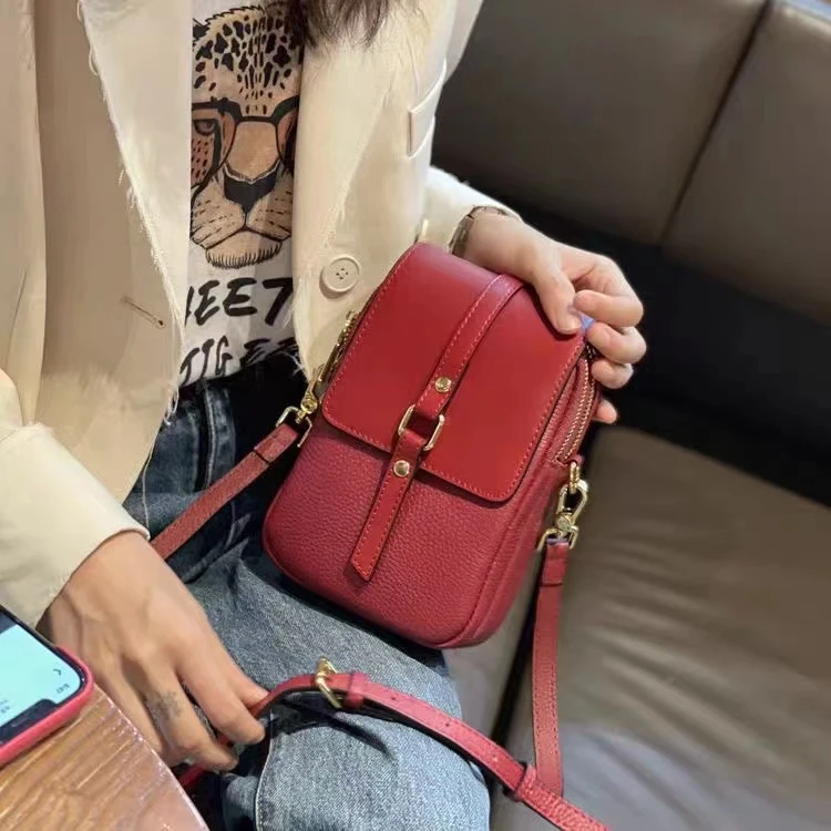 头牛双隔层翻盖竖款手机包斜挎包高21宽14厚7CM