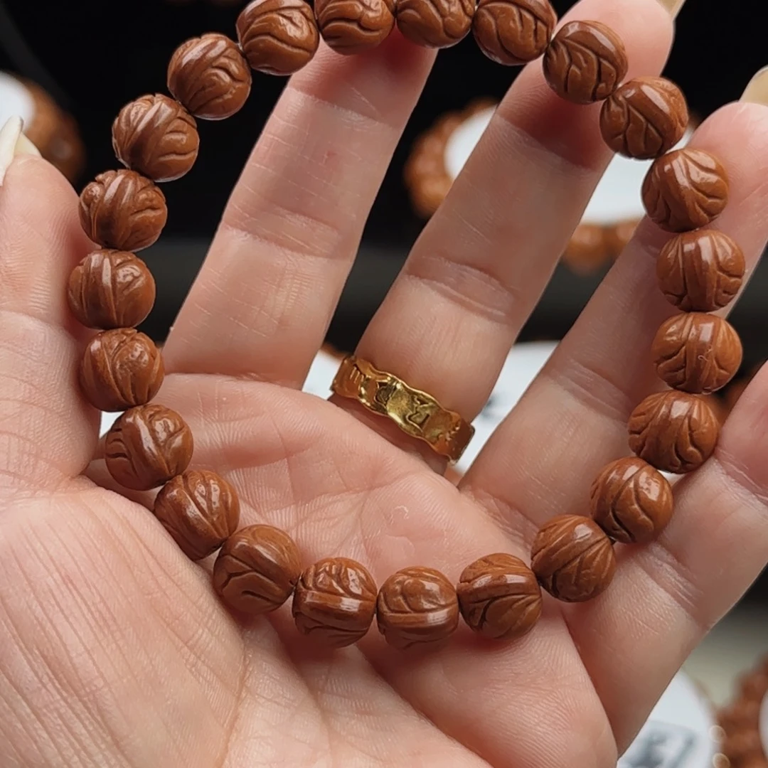 花***.手串桃核元宝手手串