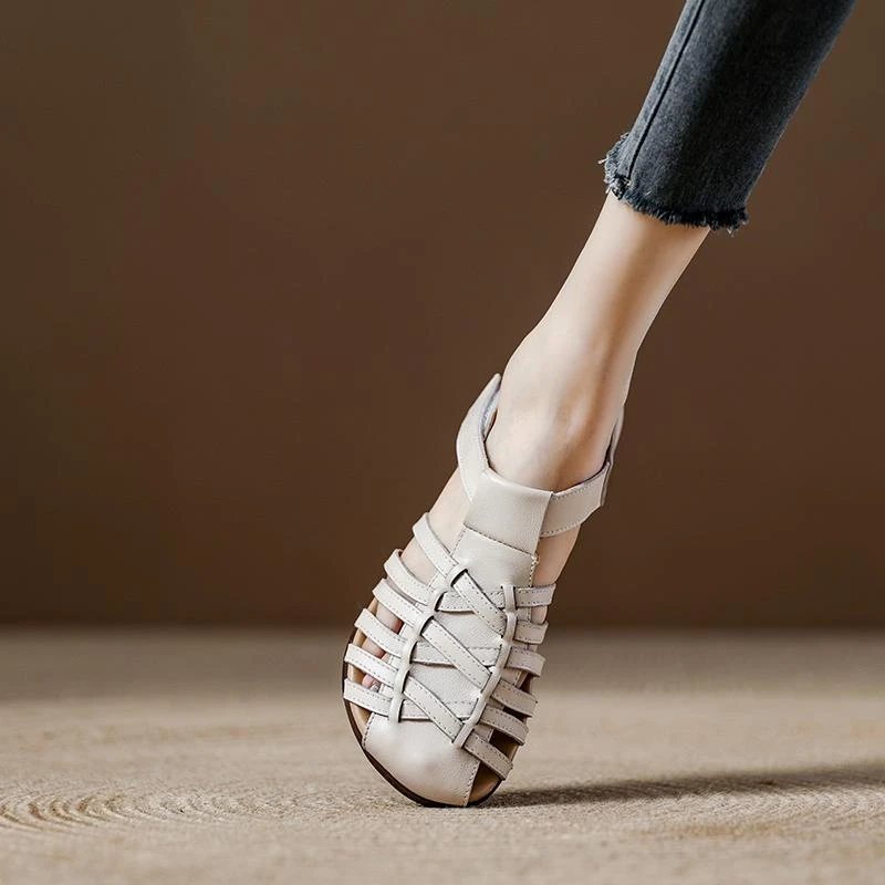 2025年夏季英伦风真皮圆头手工编织镂空软底女鞋罗马包头凉鞋牛皮
