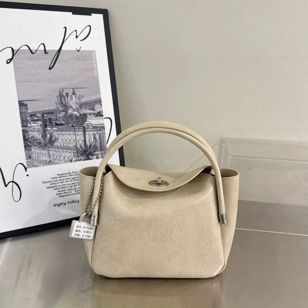 【福利价  NO退NO换】单根扣式纯色斜挎包水桶包复古手拎包ins