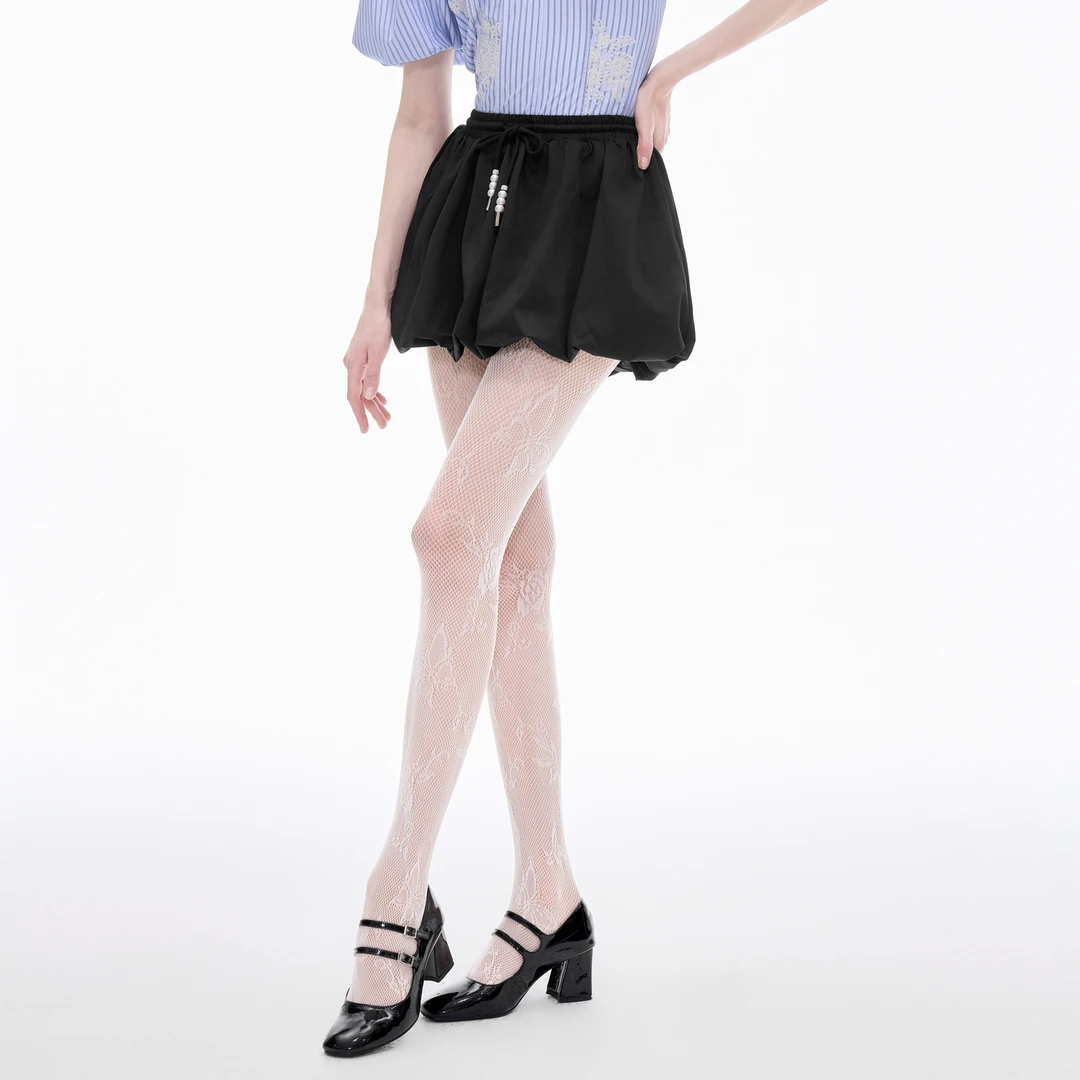 可可尼cocoon半身裙女2025新款春秋短款气质小个子裙子黑色花苞裙