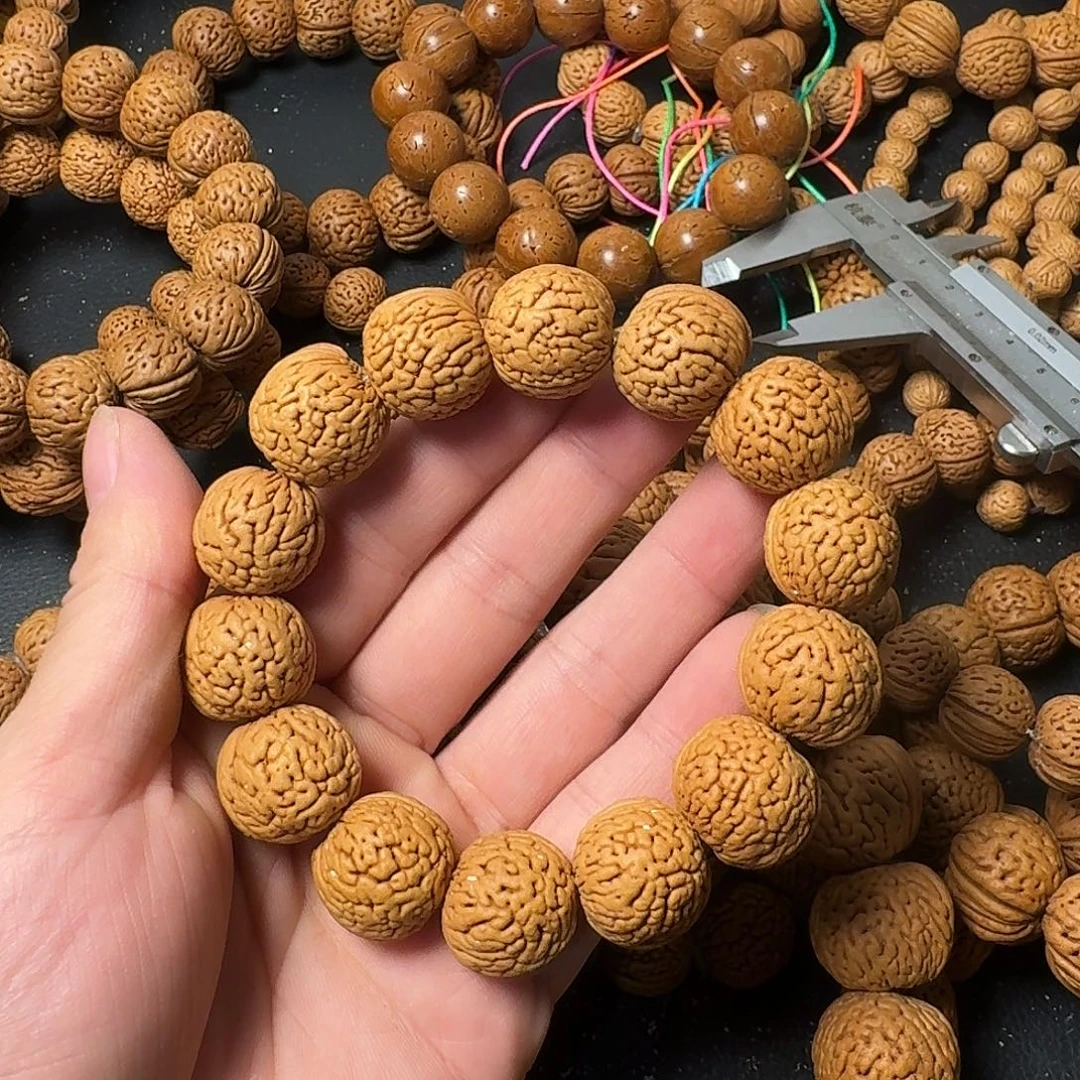 十***晶桃核吊坠野生肌肉手串