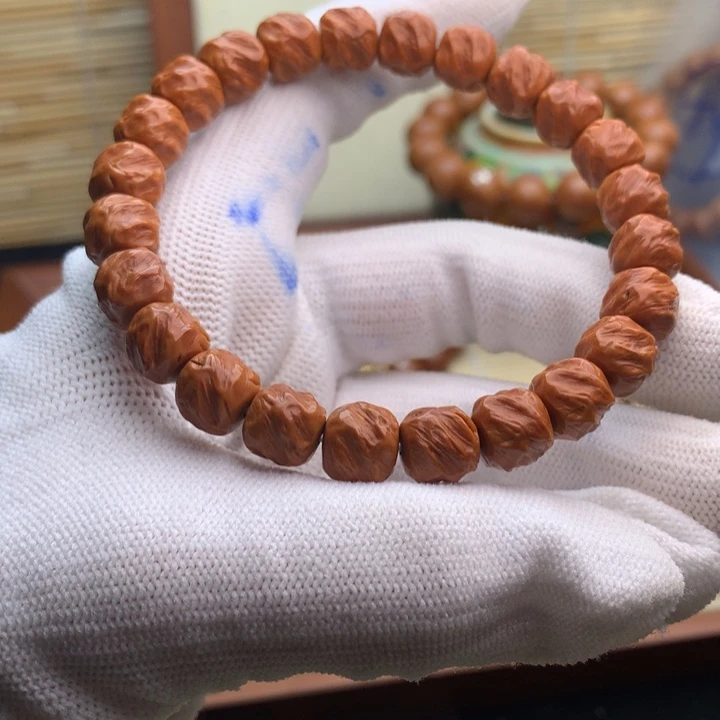 洋***9桃核吊坠龙纹熔岩无相