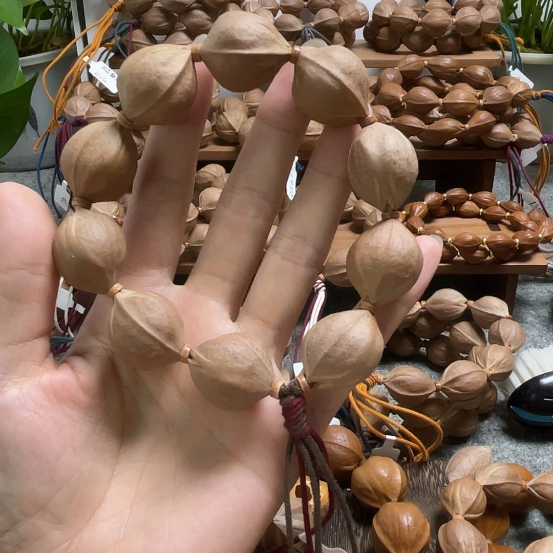 阳***家吊坠橄榄核梅林铁核