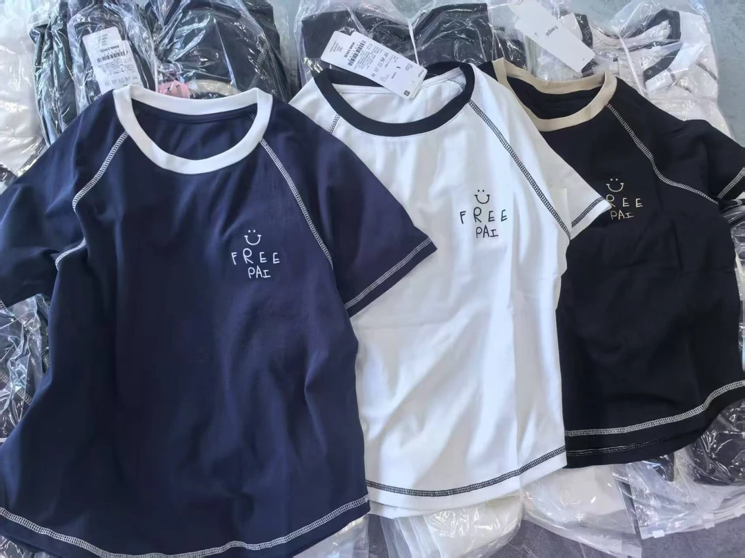 夏季新款显瘦时尚字母印花弧形下摆不规则上衣