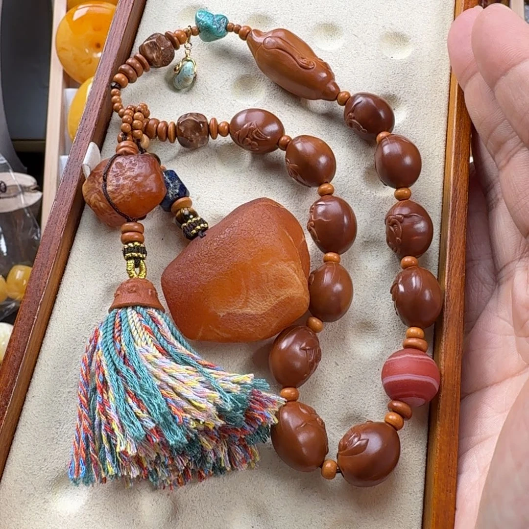 安***呢橄榄核未镶嵌吊坠蜜蜡