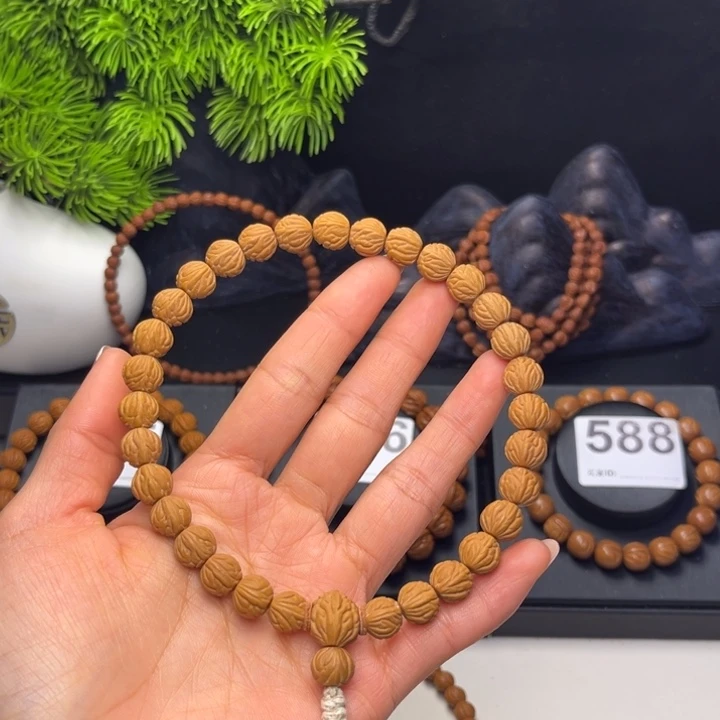 闻***草吊坠桃核凤羽0.9➕