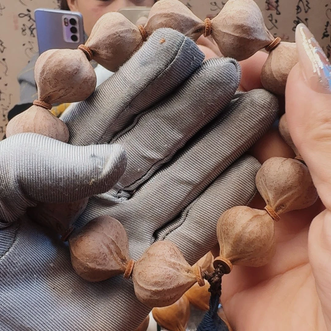 吉***油橄榄核手串三面佛