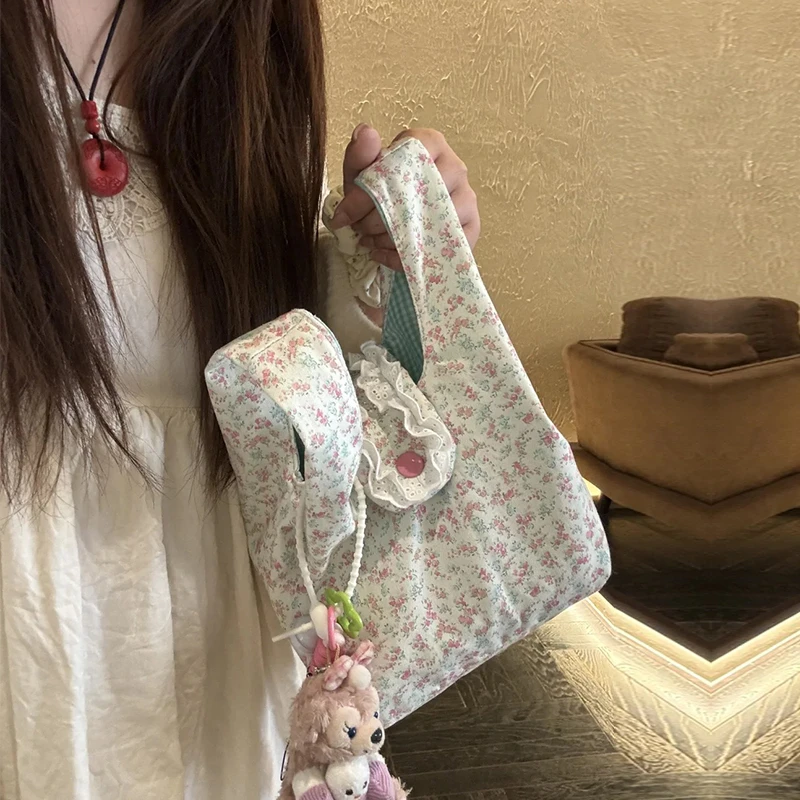 韩系镂空碎花帆布包女通勤上班新款蕾丝花边刺绣手提菜篮子水桶包