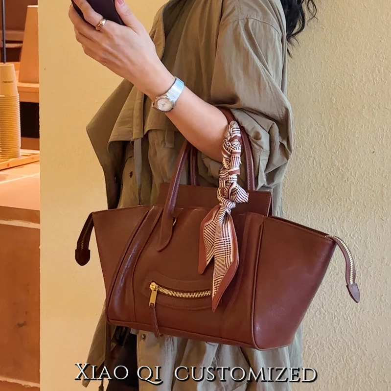 Xiao Qi头层牛皮翅膀笑脸包时尚复古手提包个性潮流机车包韩版潮