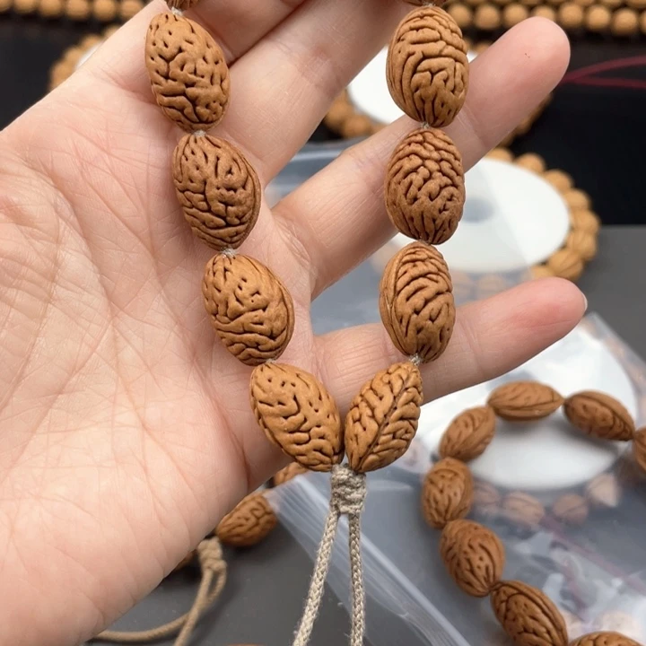 看*笑12.3尺寸野生桃核手持