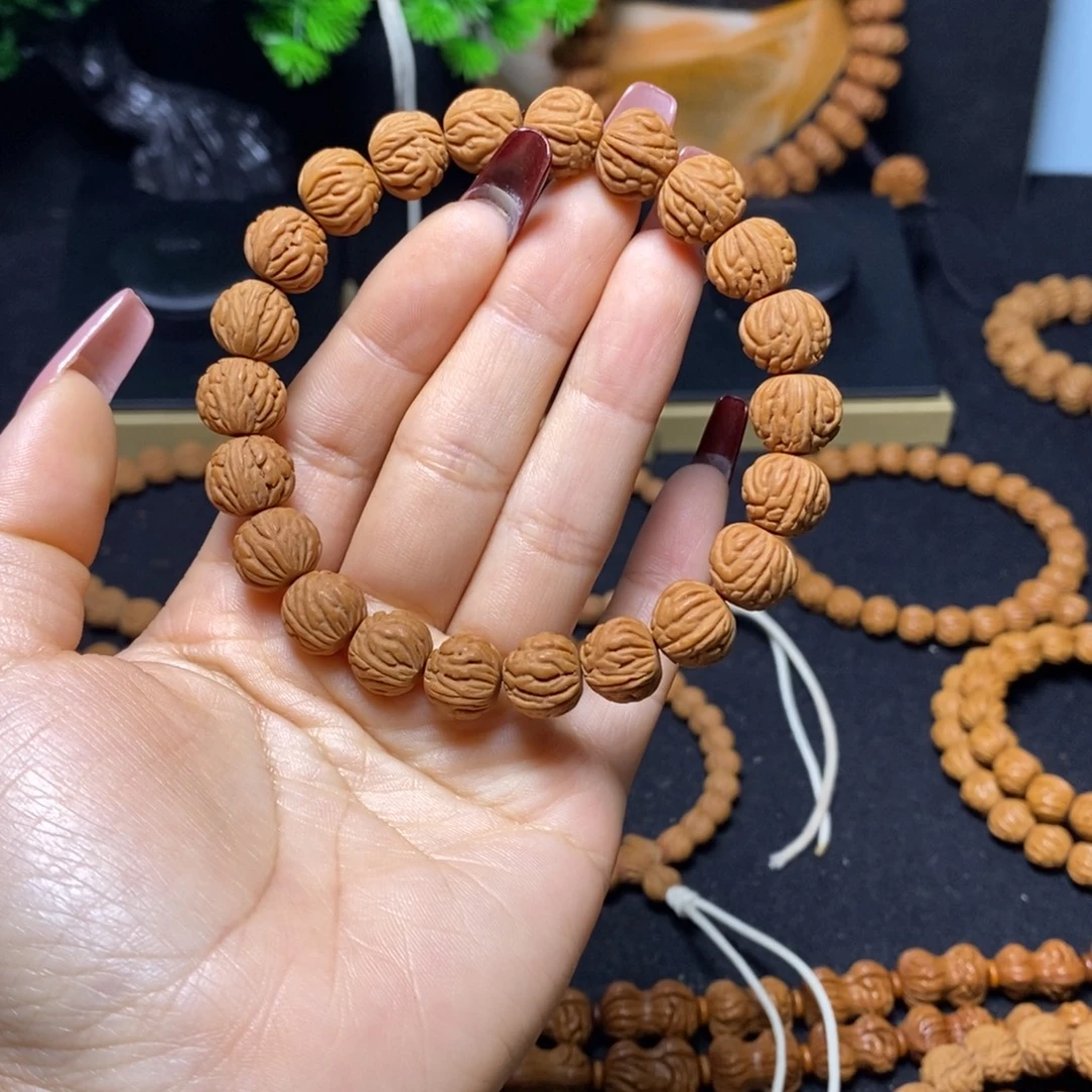 陀***轮桃核吊坠秦岭文玩