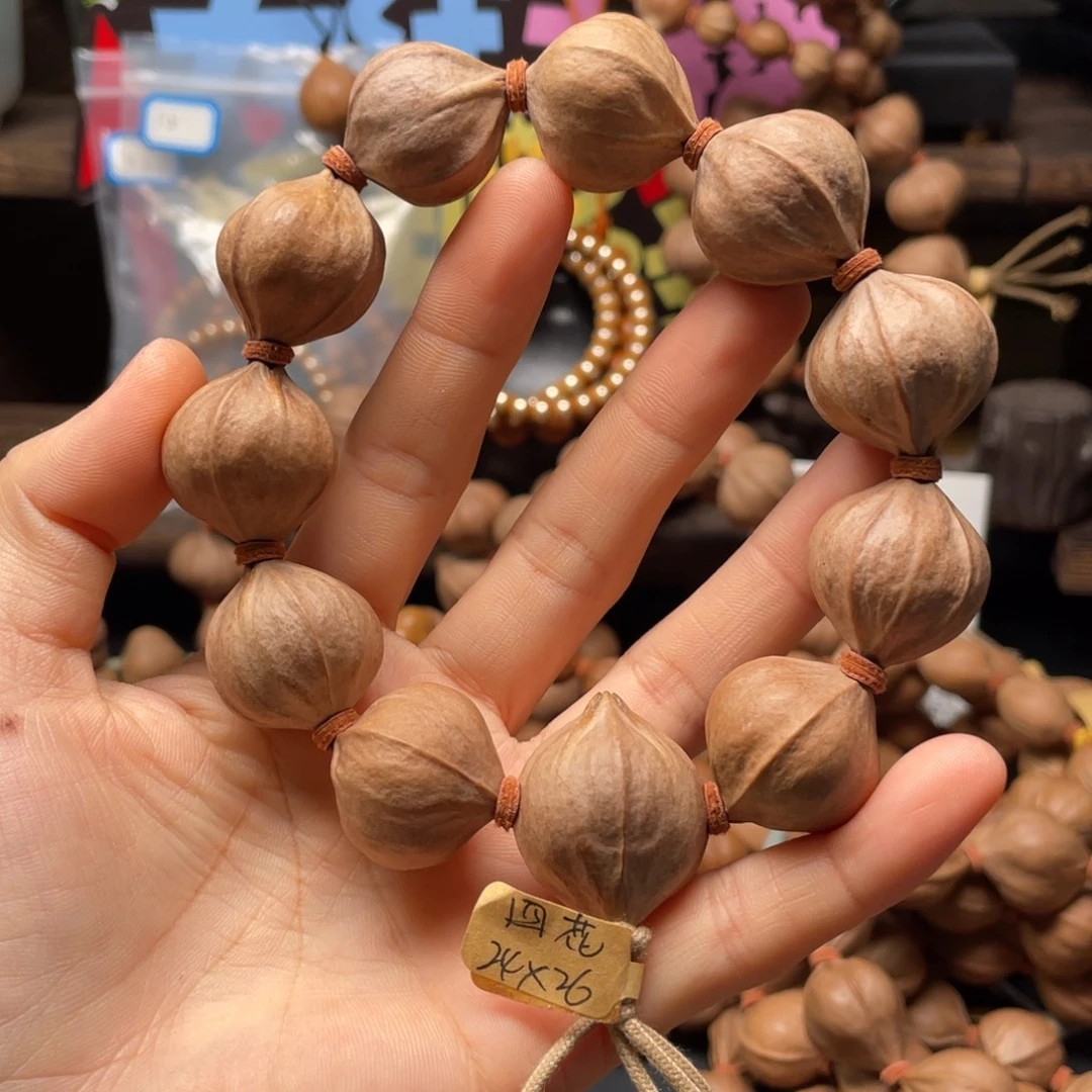 用***i橄榄核吊坠2426四花铁核