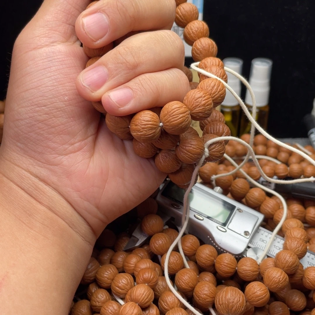 猴头核桃吊坠凤羽手持