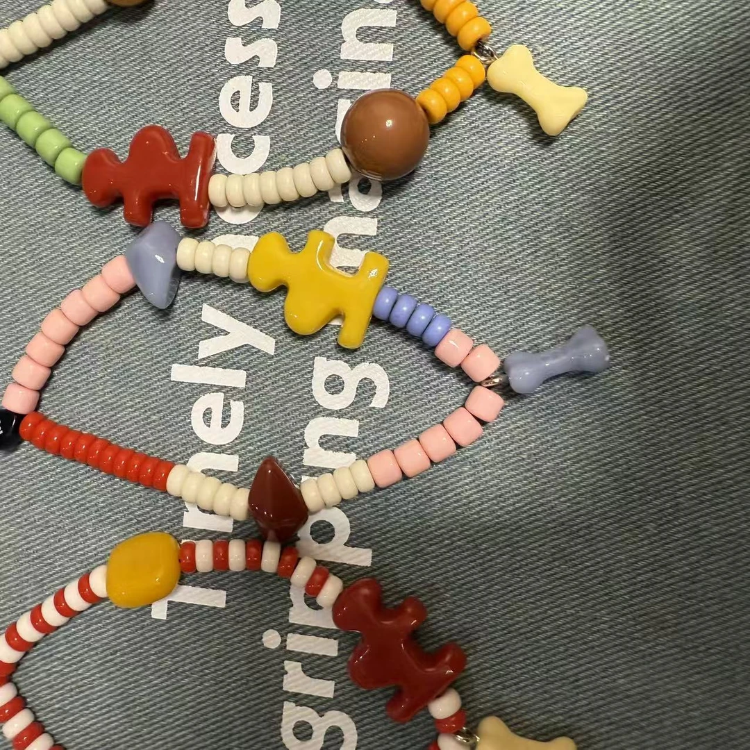 T家i标骨头手机链挂件