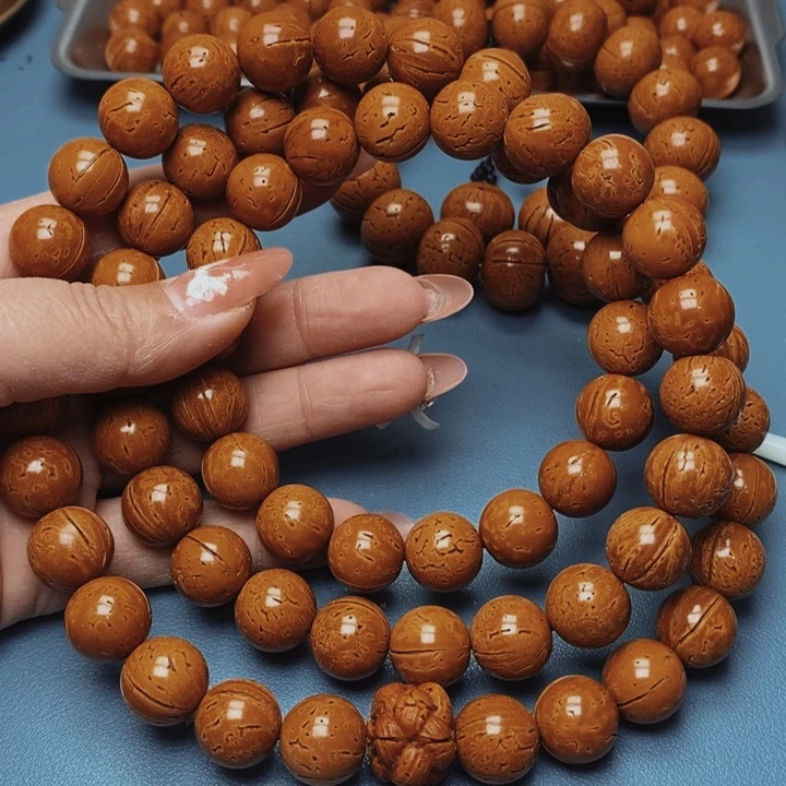 顾*少桃核脖挂极限圆15花皮色差66颗