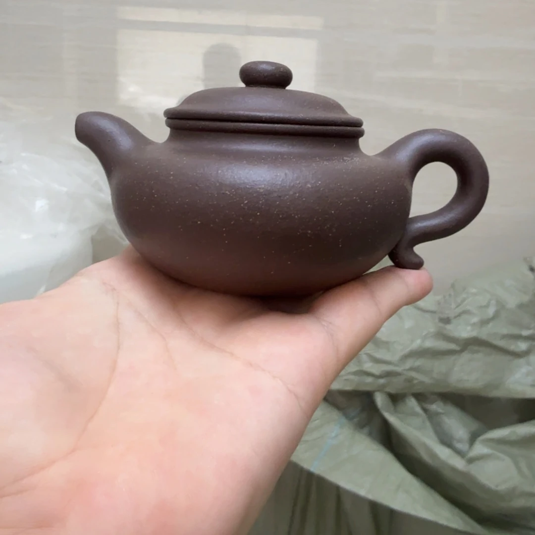 茶杯紫砂微瑕的壶