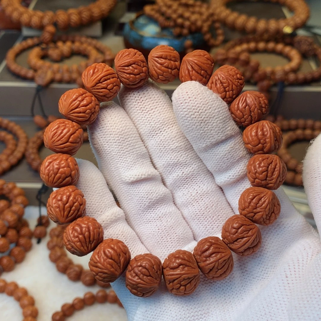 搬***人桃核手串秦岭龙纹