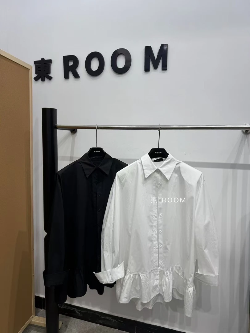 25105#【東Room】2025春季新款简约纯色荷叶边下摆中长款宽松衬衫女