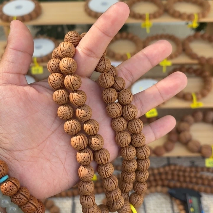 I***3非金属木质野生桃核手持56颗