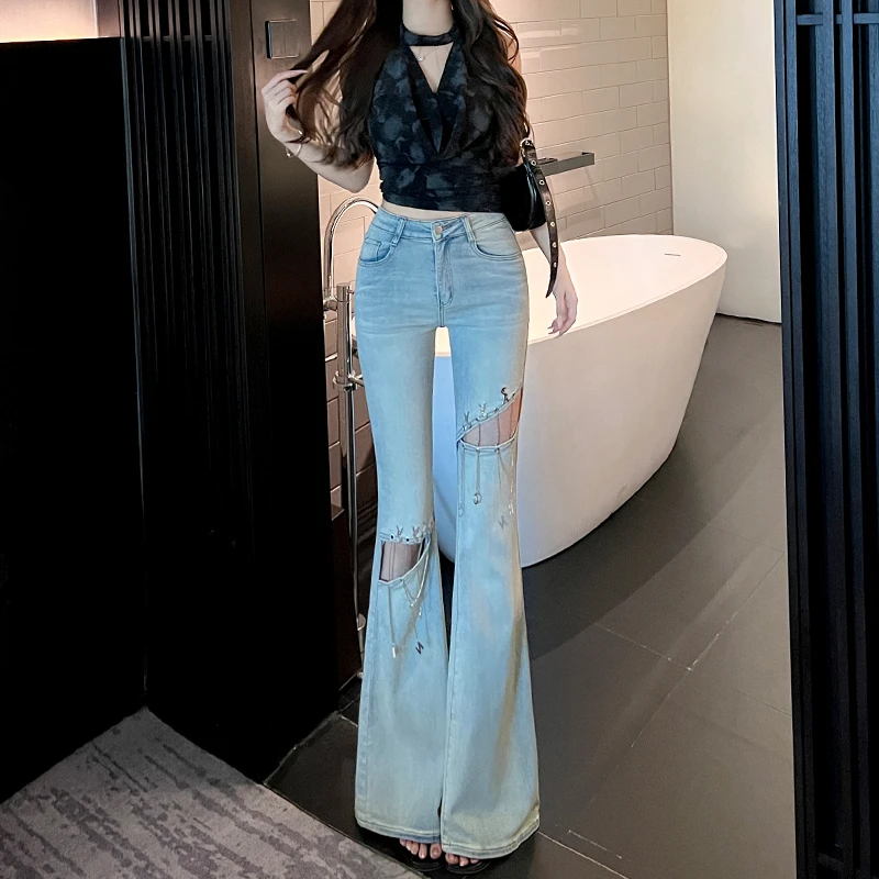 浅蓝色破洞镂空重工链条微喇叭牛仔裤女秋薄款2025新款中高腰显瘦