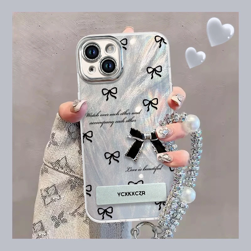 黑色英文蝴蝶结手机壳适用于苹果14pro精孔羽纱壳15/13全包12女款