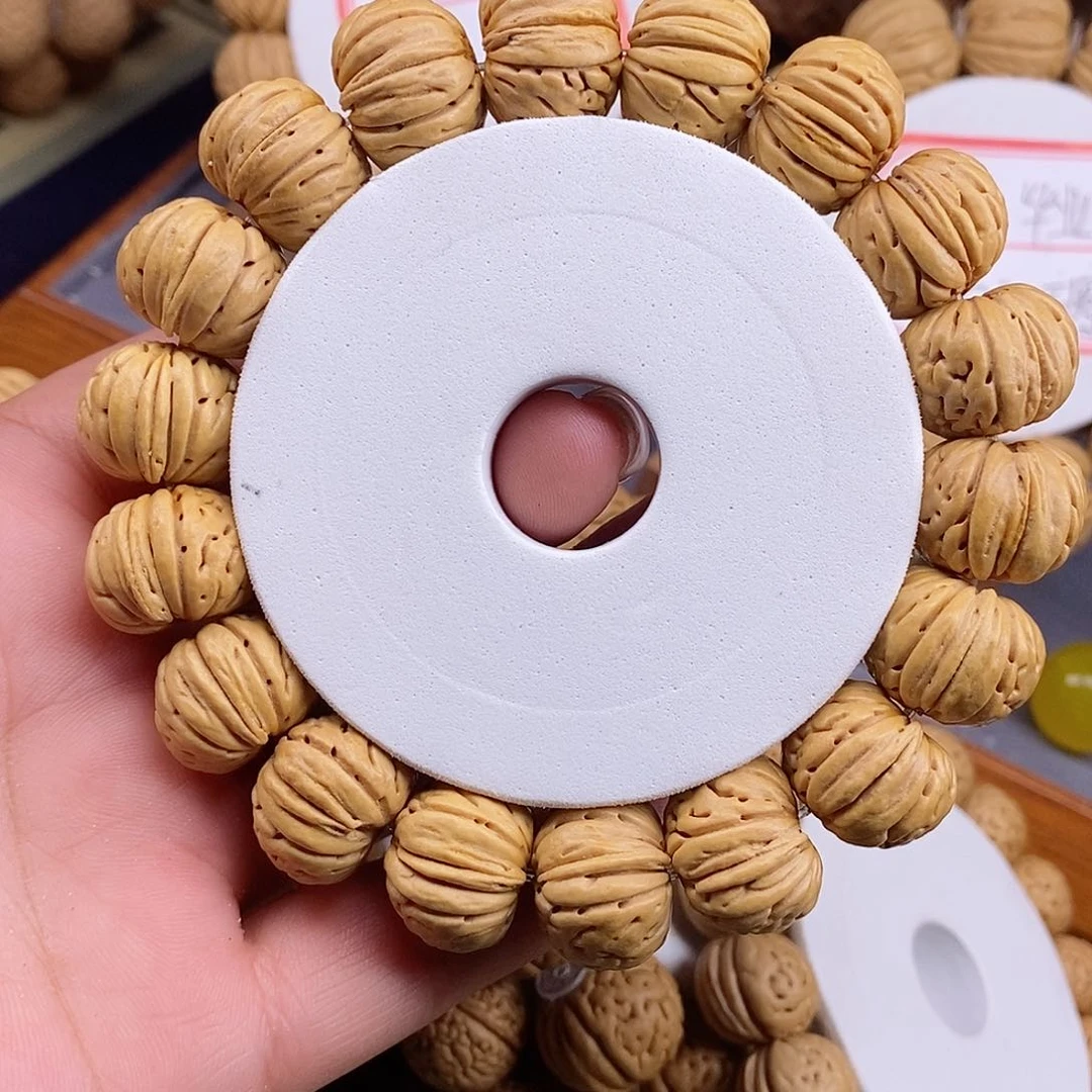 桃核手串林****”老树纽扣1.8