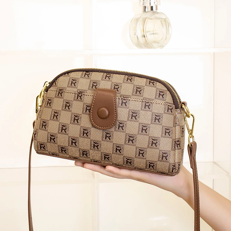 女士斜挎包2025新款手机包网红高级小众设计单肩包中年包包