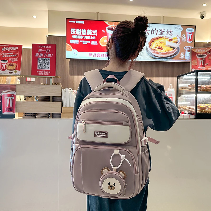 减负护脊超大容量中学生初中生书包女高中生女生小学生双肩背包潮