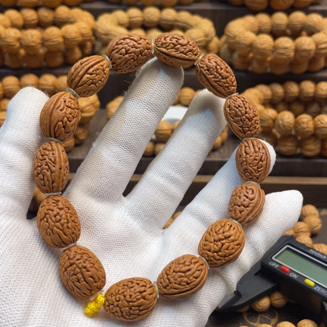 手串桃核红皮小钱袋子