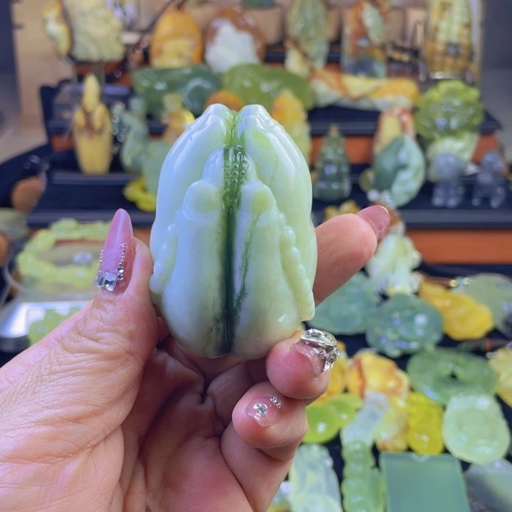 蛇纹石玉手把件合金炽**晖